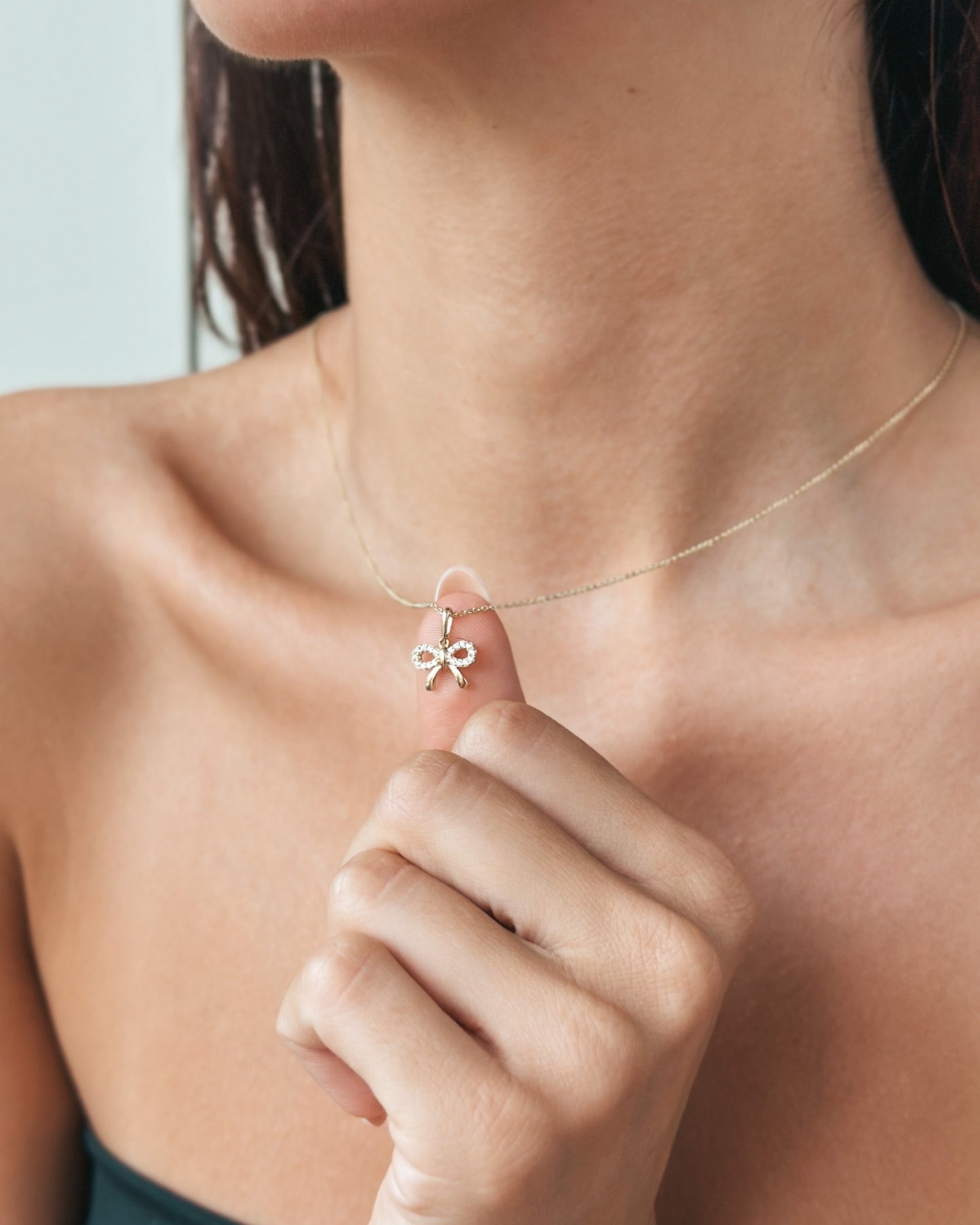 Ciondolo in oro giallo Bow Charm - Indira