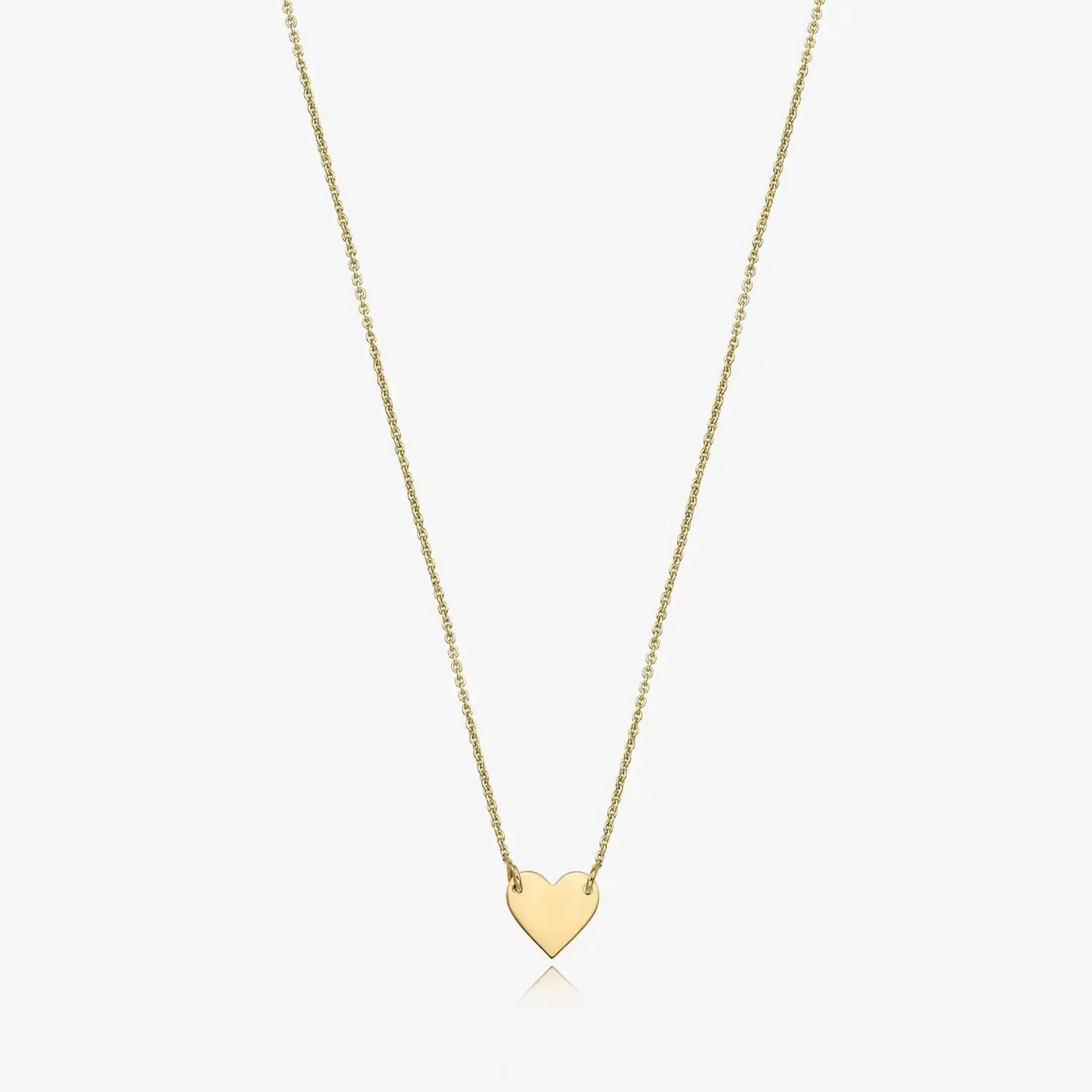 Collana in oro 14K con ciondolo a forma di cuore su sfondo bianco.