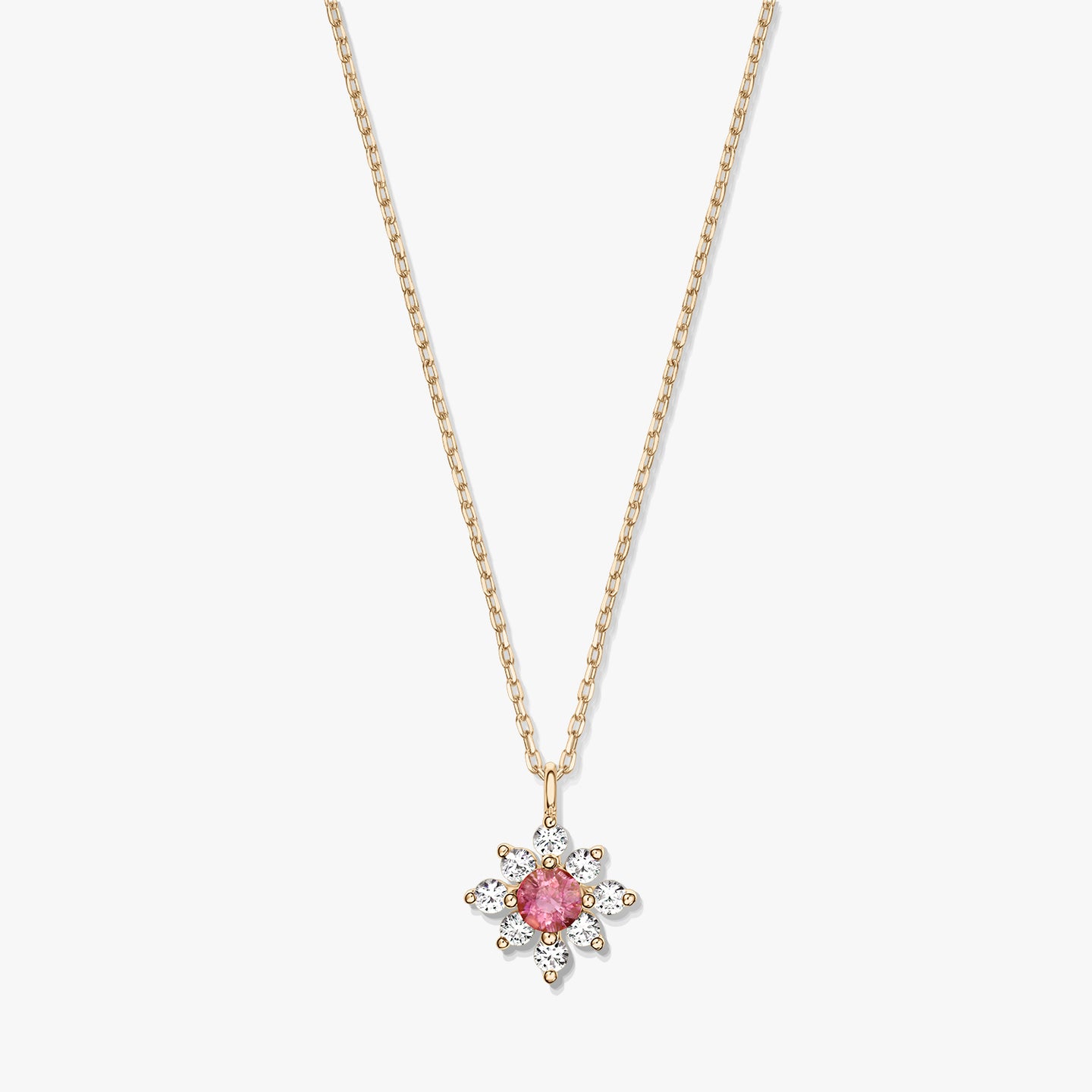 Elegante collana in oro 14K con pendente a fiore con tormalina rosa centrale circondata da zaffiri bianchi su sfondo bianco.