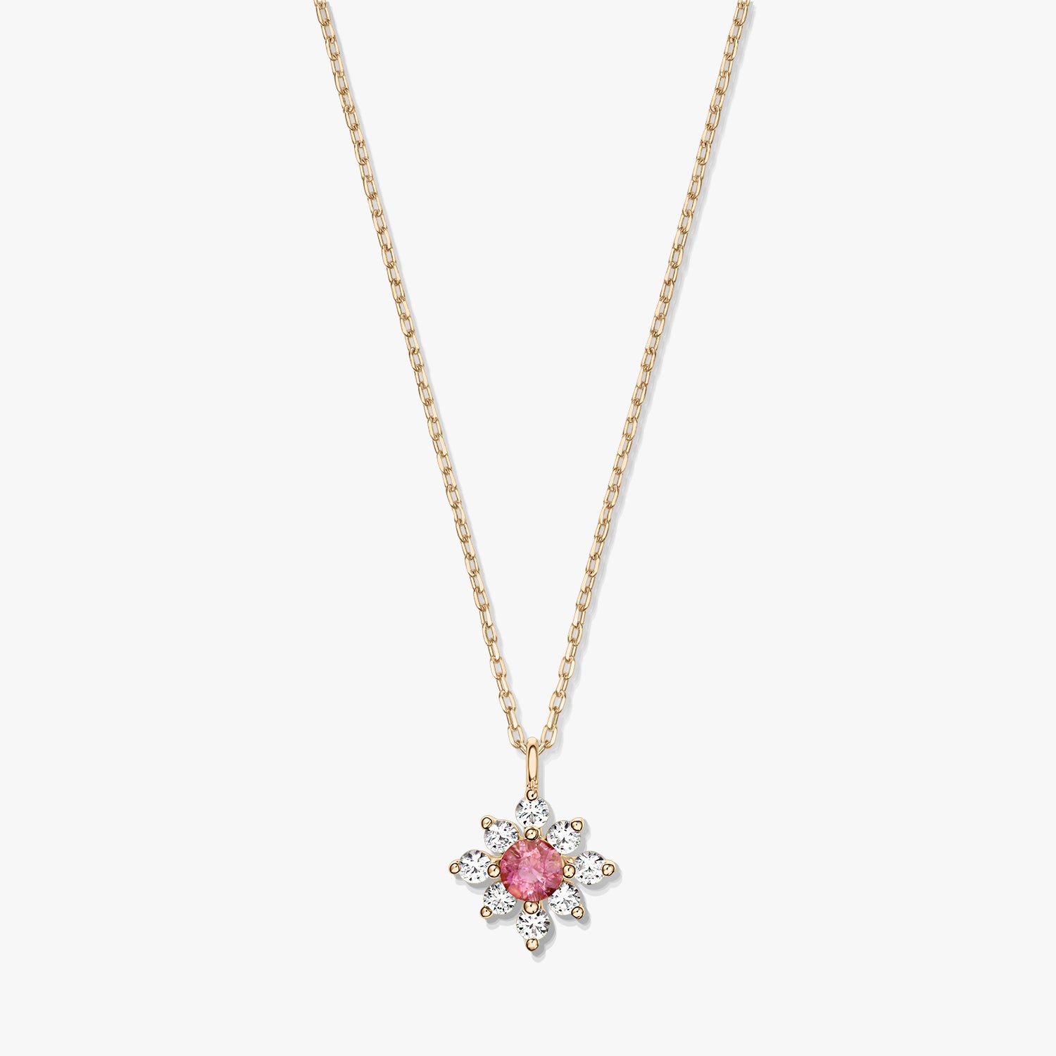 Elegante collana in oro 14K con pendente a fiore con tormalina rosa centrale circondata da zaffiri bianchi su sfondo bianco.