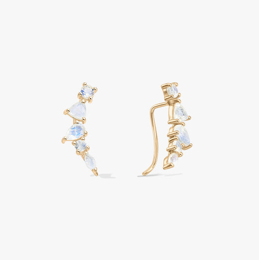 Coppia di orecchini ear climber con ear cuff in argento 925 con finitura color oro e pietre di luna a taglio misto, mostrati in vista frontale e laterale su sfondo bianco.
